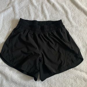 Lululemon black mid rise Track That 5” lined shorts